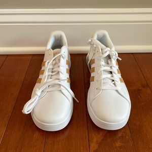 Brand New Adidas Gold Sneakers. Big kid size 6 or women’s size 8. New with tags.
